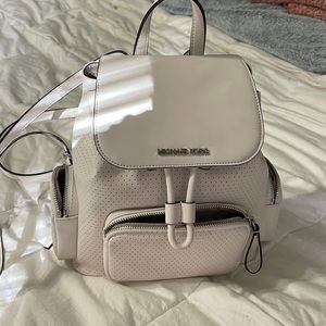 All white medium size Michael Kors backpack